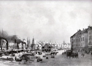 Skeppsbron omkrig 1860 när ångfartygen började tränga undan segelfartygen. Huset till vänster ser likadant ut idag.